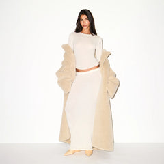 FAUX FUR OVERSIZED LONG COAT | CHAMPAGNE ON A MODEL FRONT VIEW  @ | FOCUS: 0.9, 0.1, 0.7