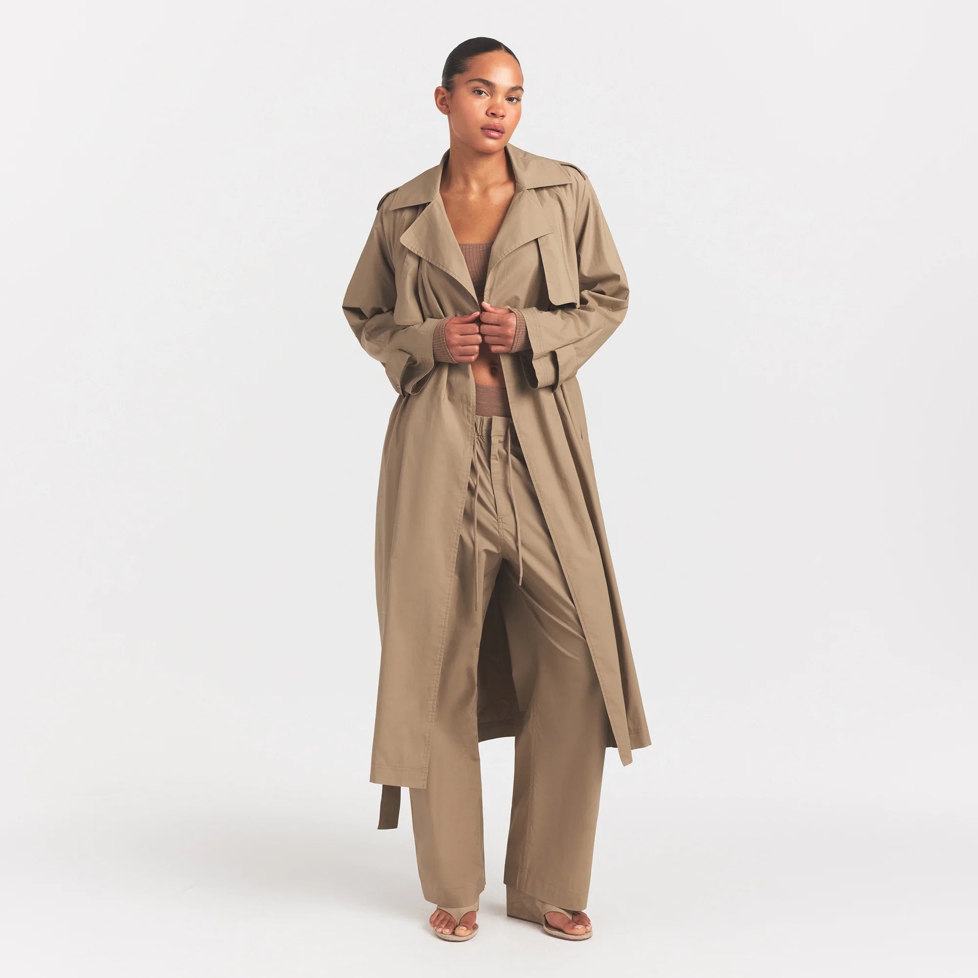 WOVEN COTTON OVERSIZED TRENCH COAT | DESERT ON A MODEL FRONT VIEW @ | FOCUS: 0.0, 1.0, 0.9