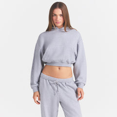 COTTON FLEECE CROPPED HOODIE | HEATHER GREY ON A MODEL SIDE VIEW @ | FOCUS: 0.0, 1.0, 0.9