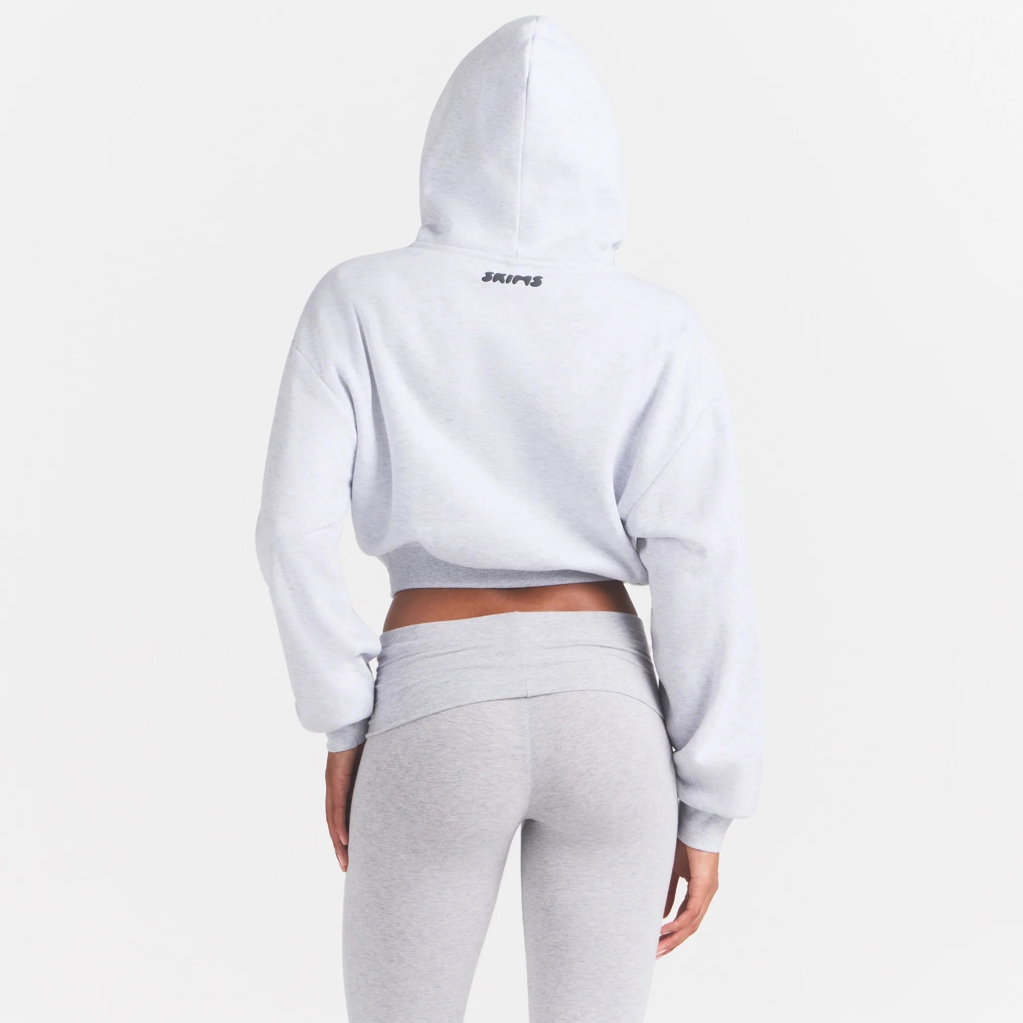 COTTON FLEECE CROPPED HOODIE | LIGHT HEATHER GREY ON A MODEL SIDE VIEW @ | FOCUS: 0.0, 1.0, 0.9