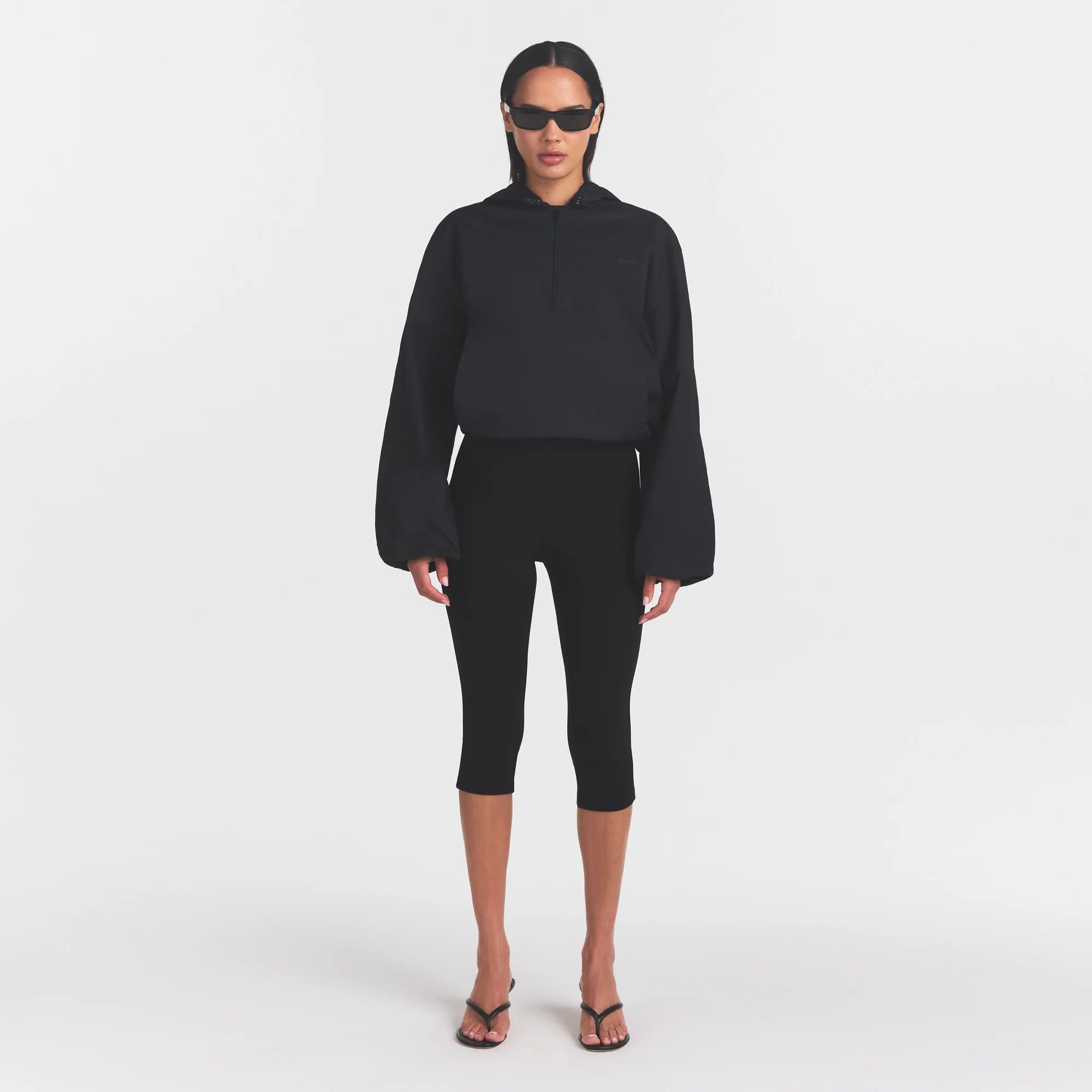 WOVEN COTTON HALF ZIP PULLOVER | ONYX ON A MODEL FRONT VIEW @ | FOCUS: 0.0, 1.0, 0.9