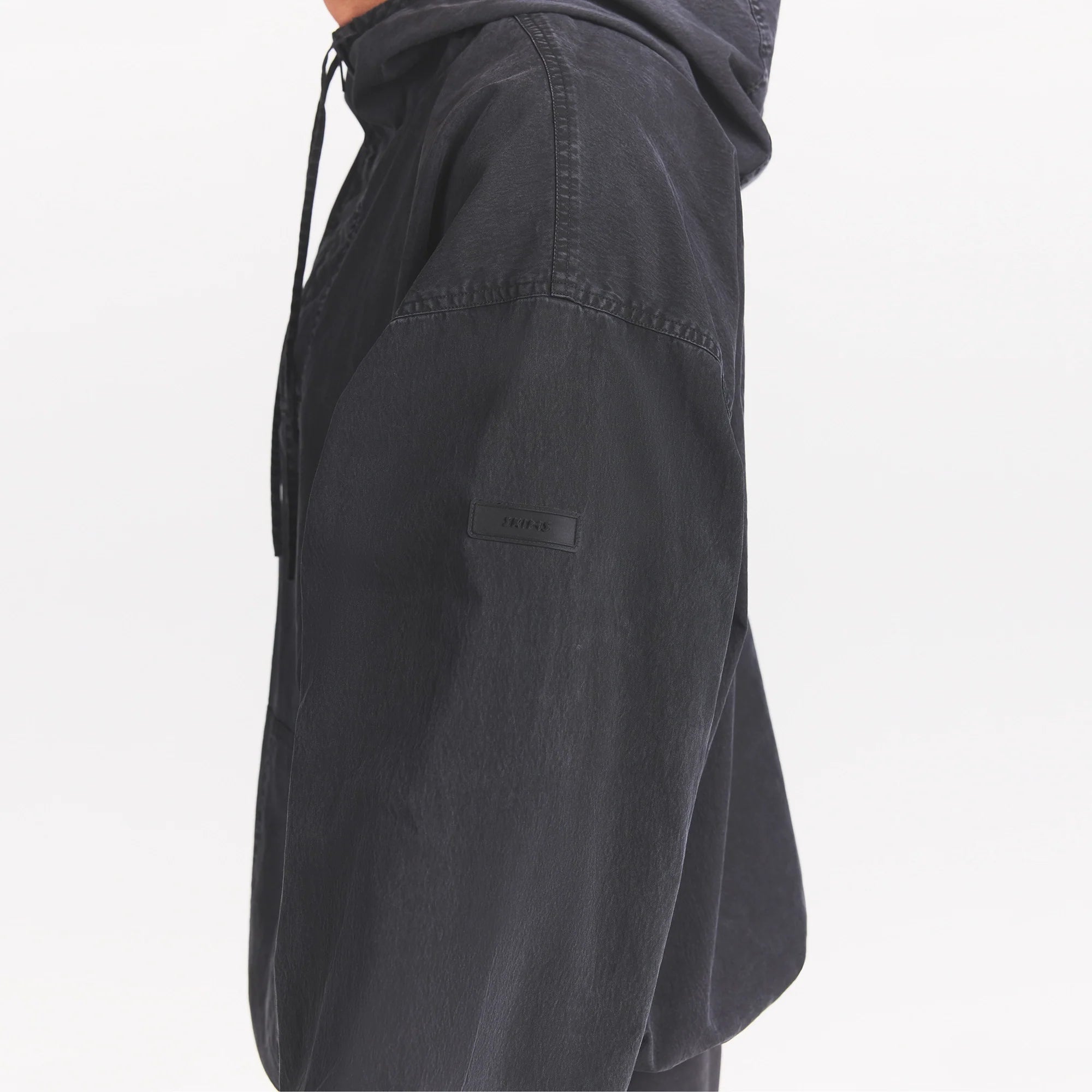 WOVEN MENS ANORAK | ONYX ON A MODEL SIDE VIEW @ | FOCUS: 0.0, 1.0, 0.9