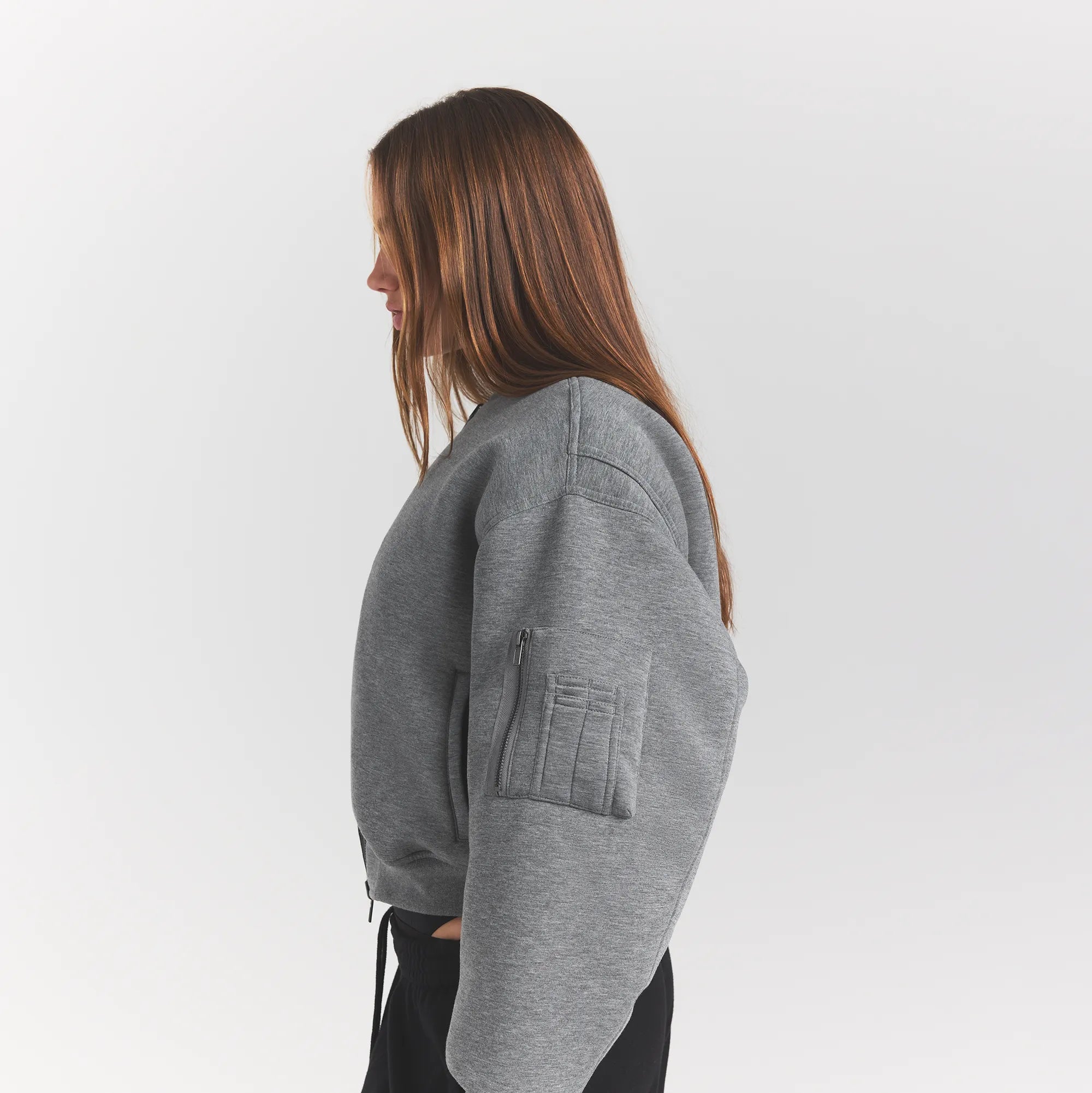 NEOPRENE OUTERWEAR REVERSIBLE BOMBER JACKET | DARK HEATHER GREY ON A MODEL SIDEVIEW @ | FOCUS: 0.0, 1.0, 0.9