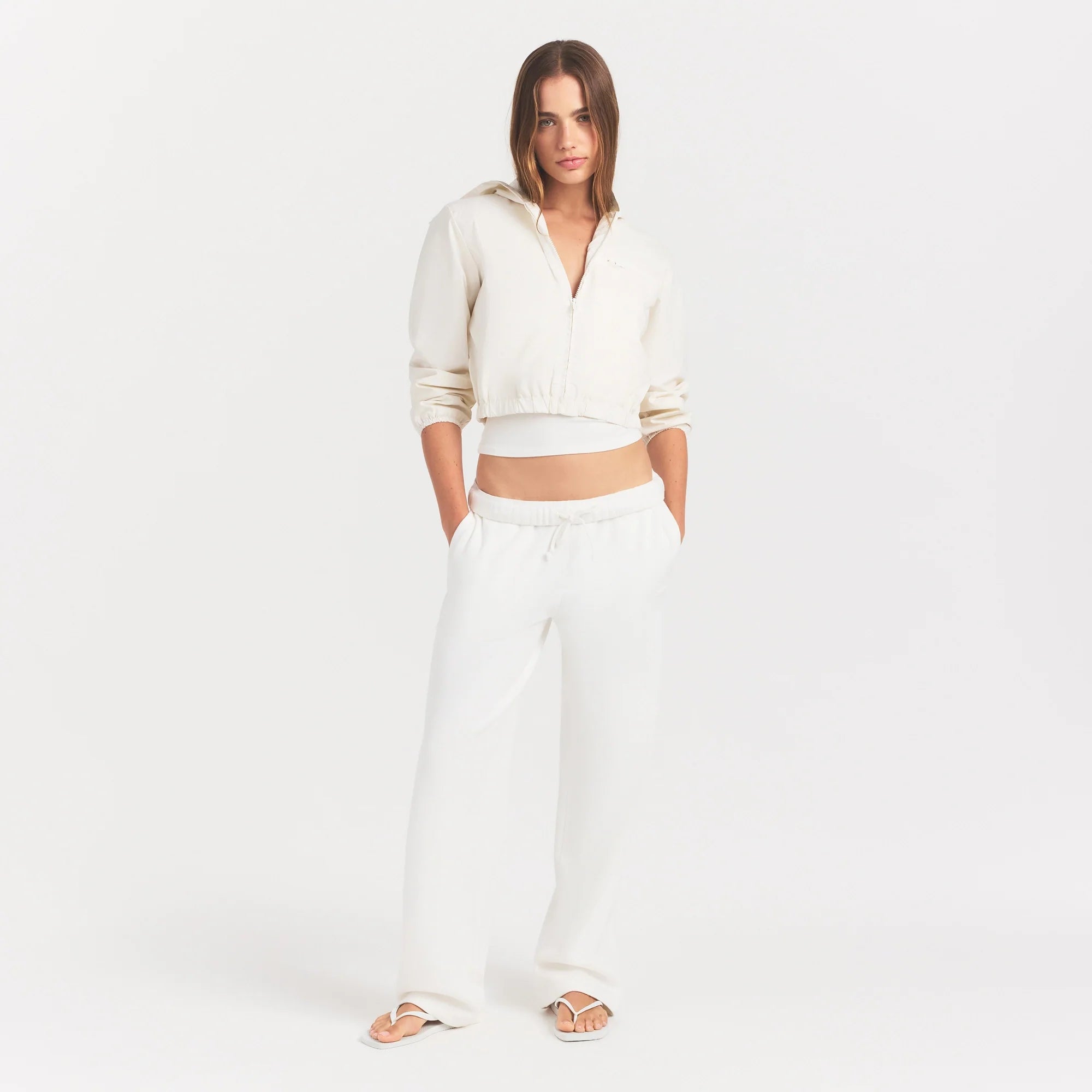 WOVEN COTTON CROPPED ZIP UP JACKET | EGRET ON A MODEL FRONT VIEW @ | FOCUS: 0.0, 1.0, 0.9