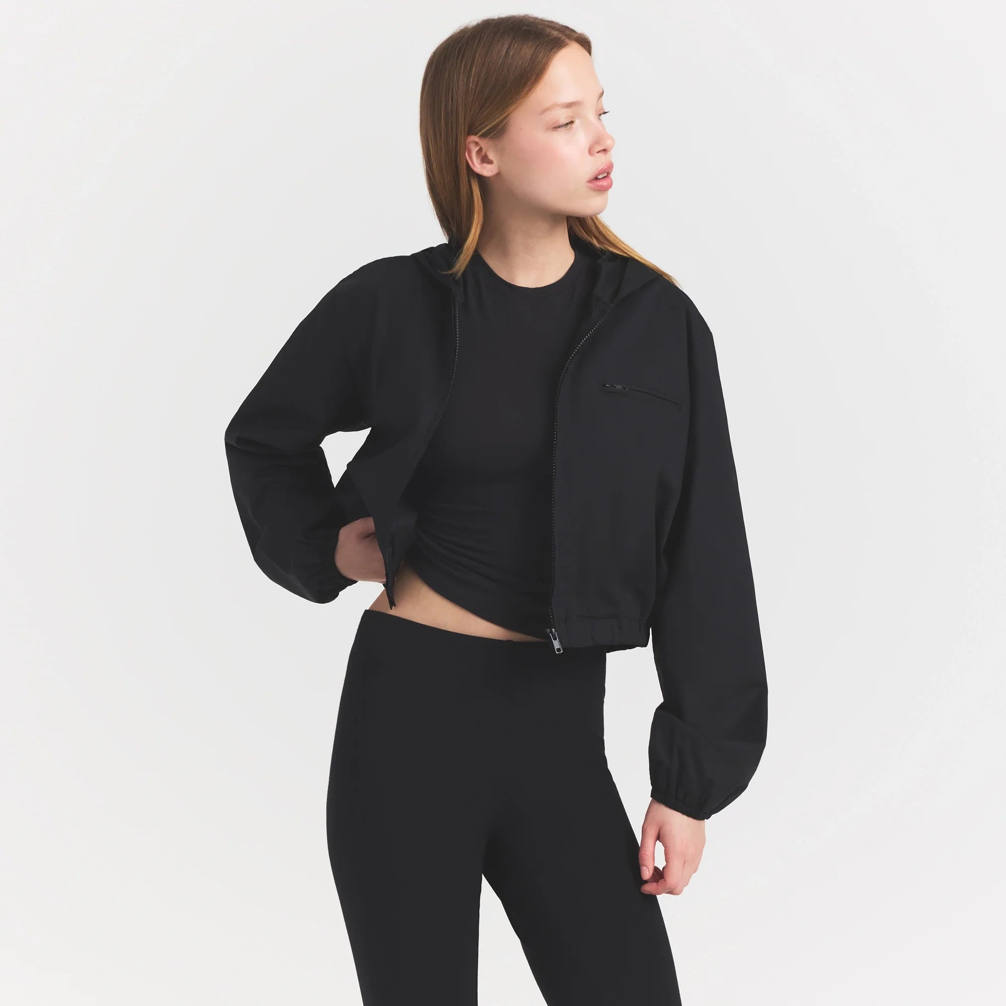 WOVEN COTTON CROPPED ZIP UP JACKET | ONYX ON A MODEL SIDE VIEW @ | FOCUS: 0.0, 1.0, 0.9