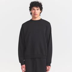 FLEECE LOUNGE MENS RELAXED HIGH CREWNECK | WASHED ONYX ON A MODEL SIDE VIEW @ | FOCUS: 0.0, 1.0, 0.9