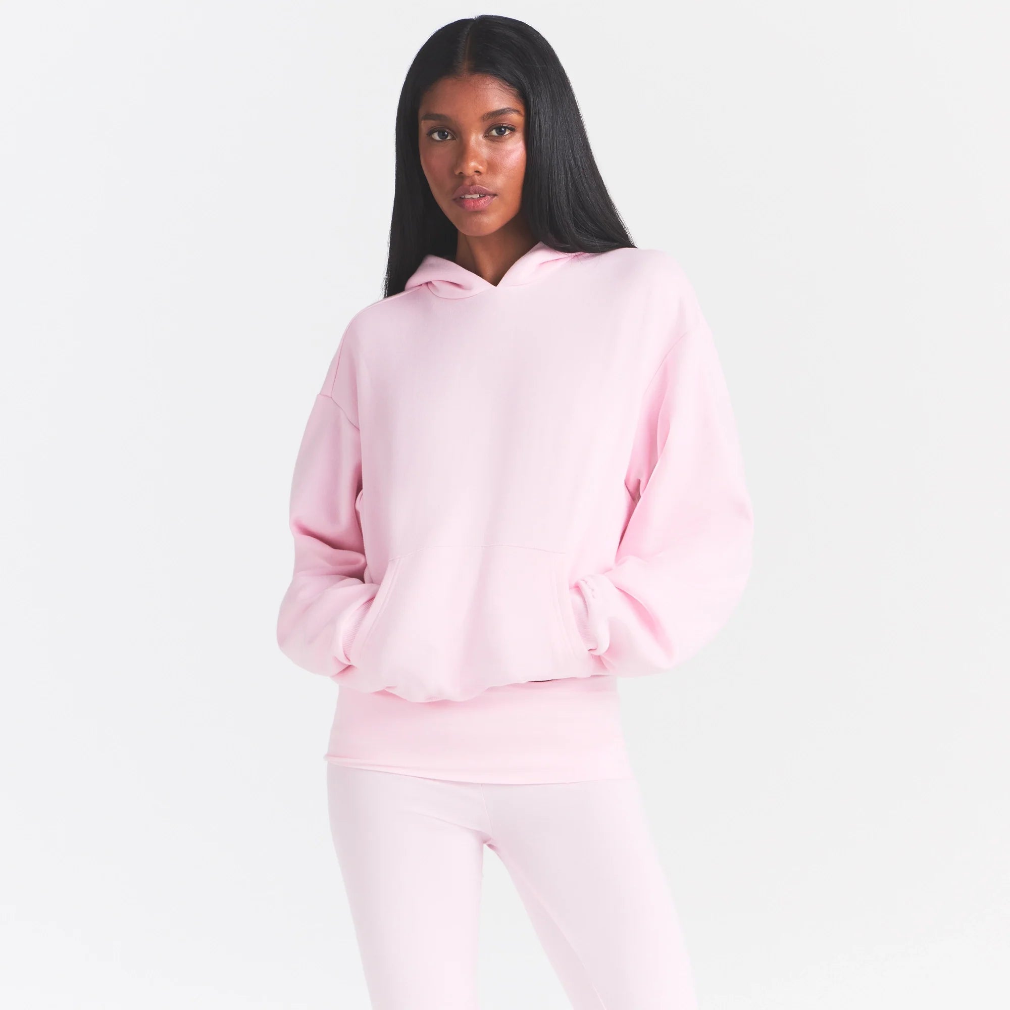 COTTON FLEECE CLASSIC HOODIE | CHERRY BLOSSOM ON A MODEL SIDE VIEW @ | FOCUS: 0.0, 1.0, 0.9