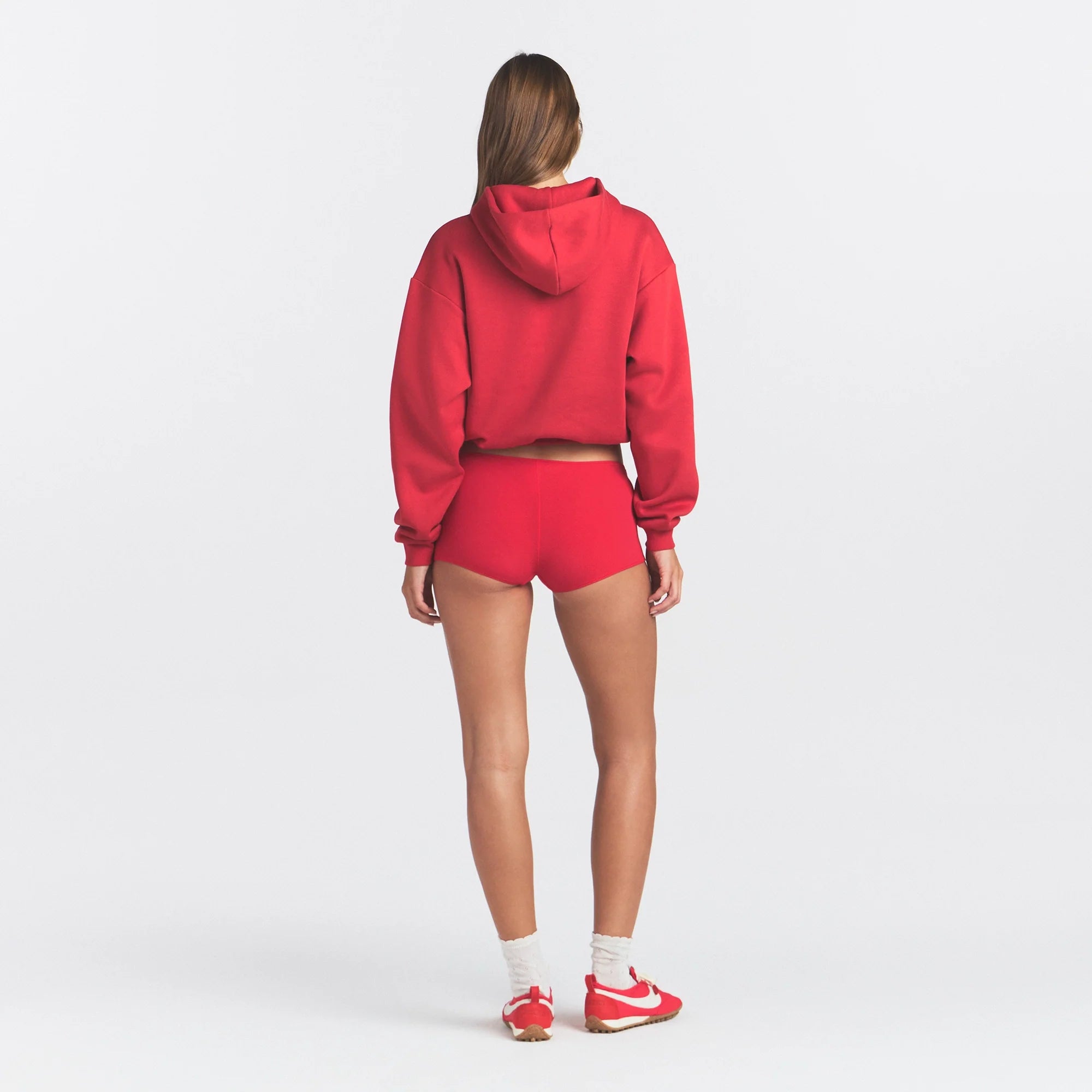 COTTON FLEECE CLASSIC HOODIE | WASHED RED ON A MODEL SIDE VIEW @ | FOCUS: 0.0, 1.0, 0.9