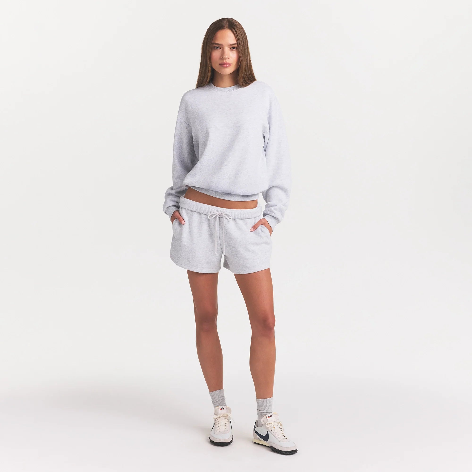 COTTON FLEECE CLASSIC CREWNECK | LIGHT HEATHER GREY ON A MODEL FRONT VIEW @ | FOCUS: 0.0, 1.0, 0.9