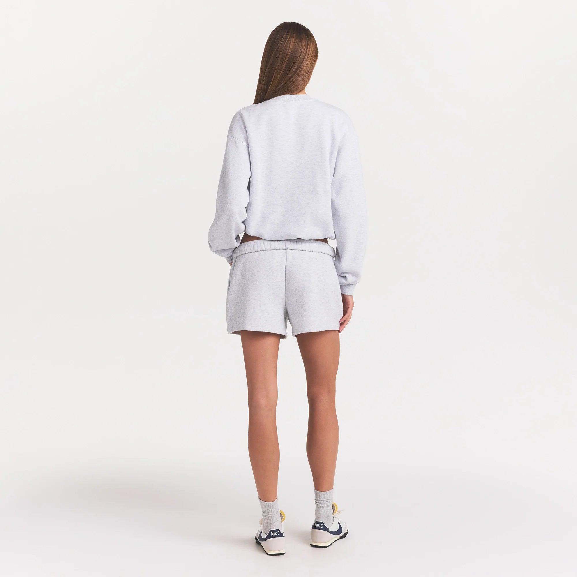 COTTON FLEECE CLASSIC CREWNECK | LIGHT HEATHER GREY ON A MODEL BACK VIEW @ | FOCUS: 0.0, 1.0, 0.9