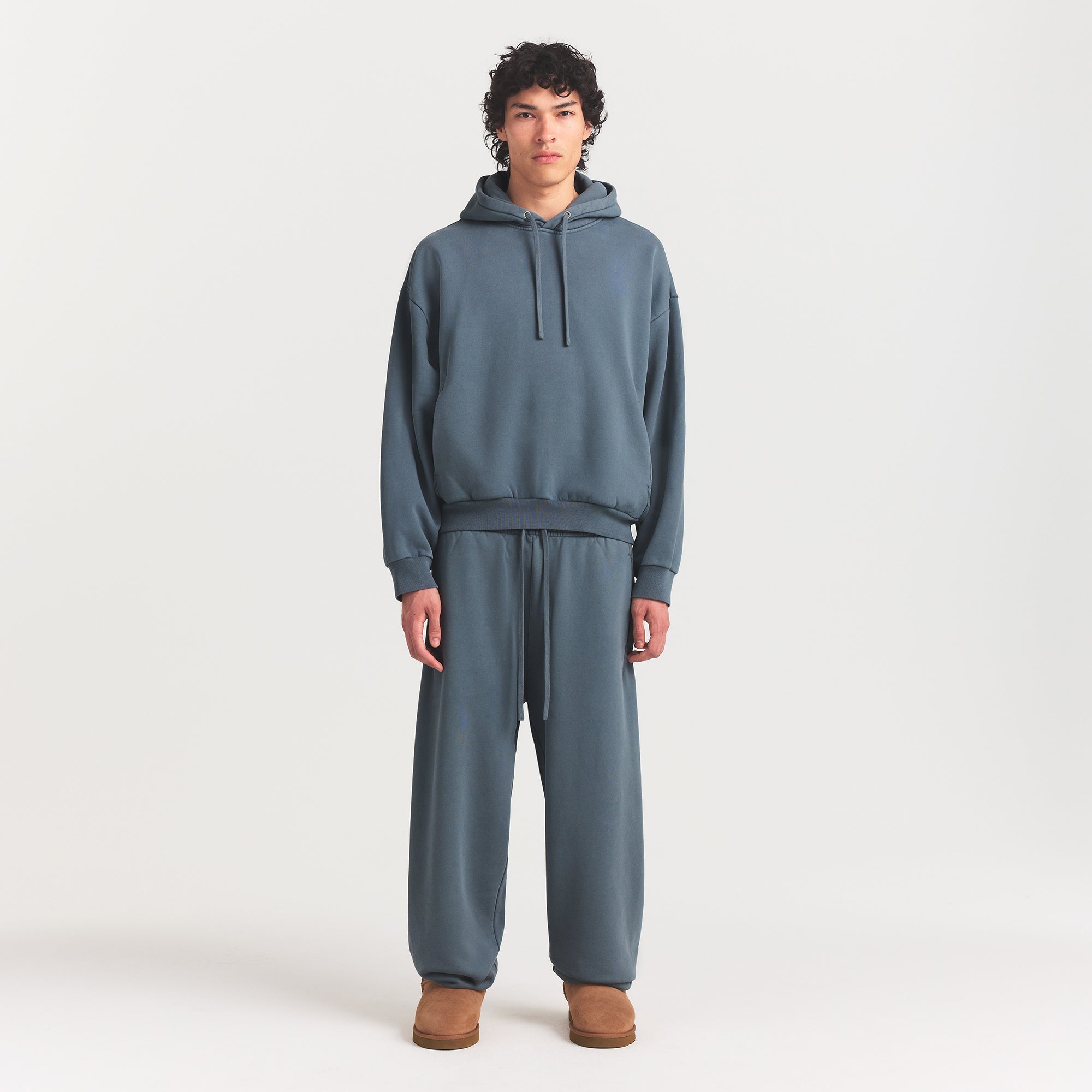 HEAVYWEIGHT FLEECE MENS HOODIE | KYANITE ON A MODEL FRONT VIEW @ | FOCUS: 0.0, 1.0, 0.9
