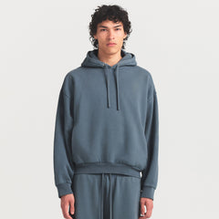 HEAVYWEIGHT FLEECE MENS HOODIE | KYANITE ON A MODEL SIDE VIEW @ | FOCUS: 0.0, 1.0, 0.9