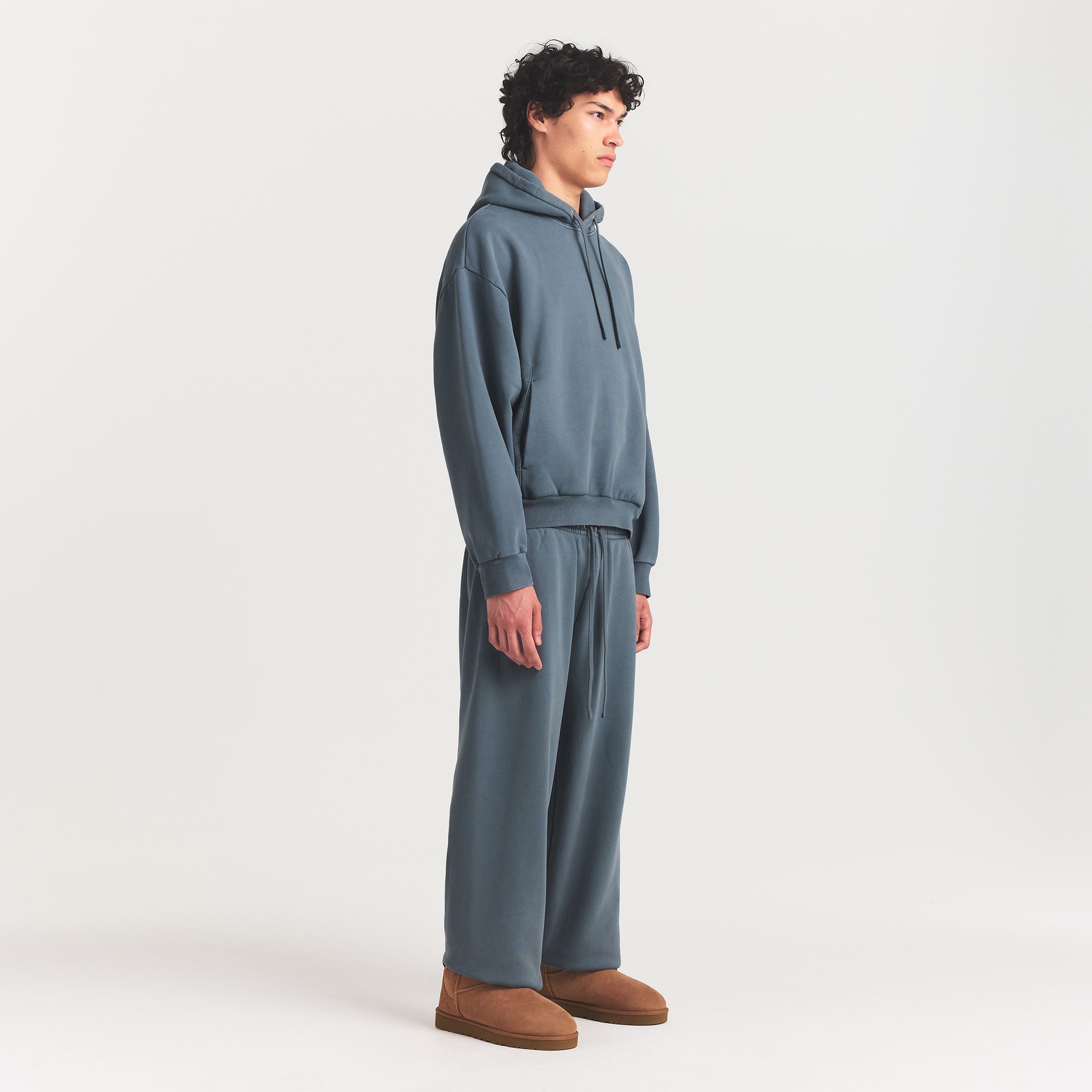 HEAVYWEIGHT FLEECE MENS HOODIE | KYANITE ON A MODEL FRONT VIEW @ | FOCUS: 0.0, 1.0, 0.9