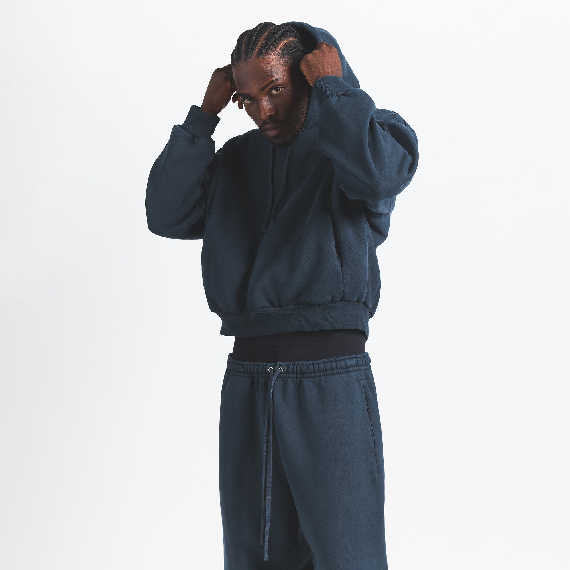 HEAVYWEIGHT FLEECE MENS HOODIE | NAVY ON A MODEL SIDE VIEW @ | FOCUS: 0.0, 1.0, 0.9