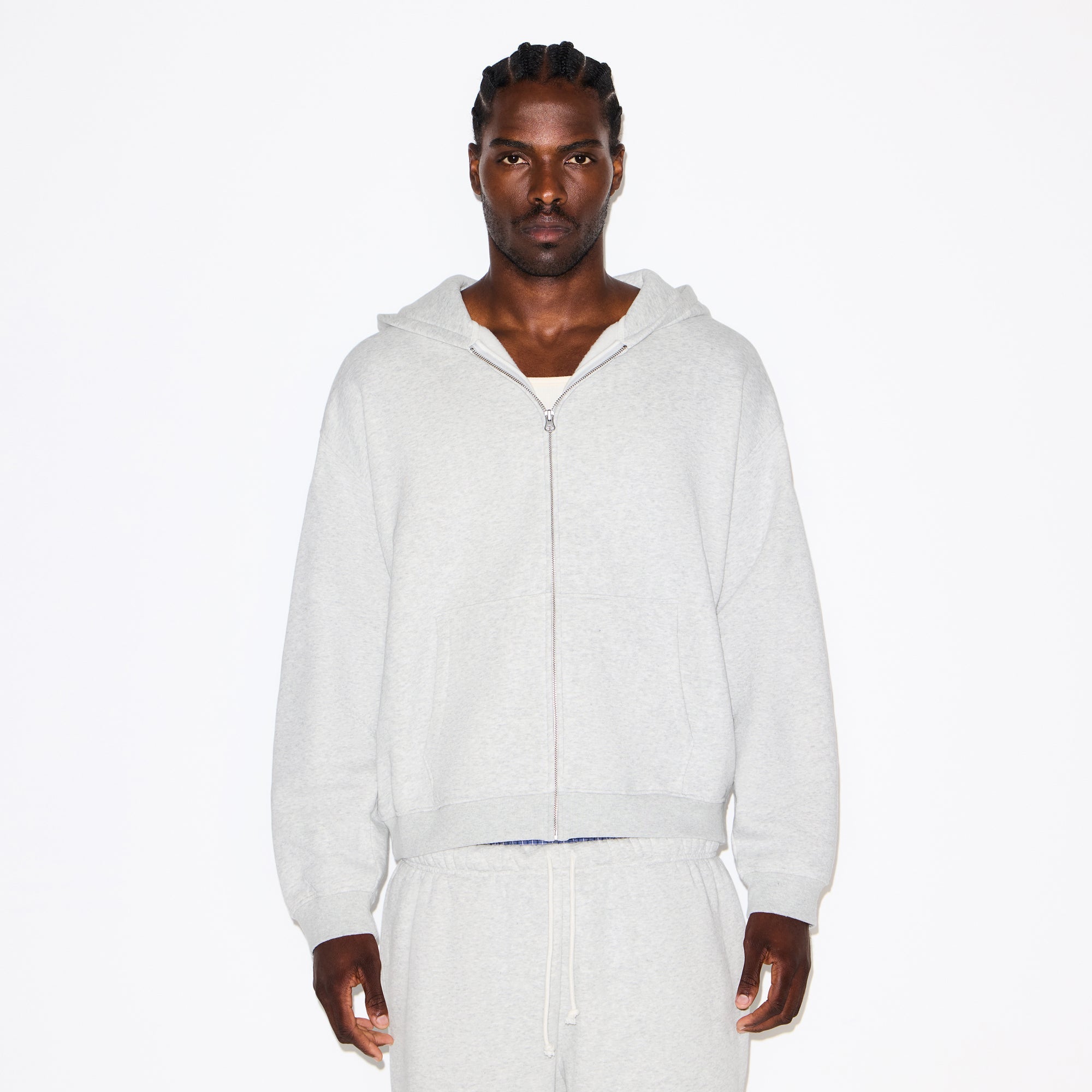 FLEECE LOUNGE MENS RELAXED ZIP UP HOODIE | LIGHT HEATHER GREY ON A MODEL SIDE VIEW @ | FOCUS: 0.0, 1.0, 0.9