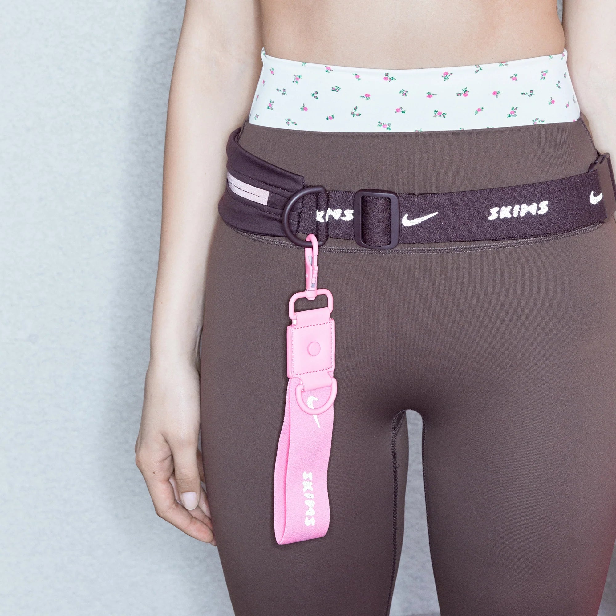 NikeSKIMS ACCESSORIES KEYCHAIN WRISTLET | LIGHT FLAMINGO CAMPAIGN @ | FOCUS: 0.0, 1.0, 0.9