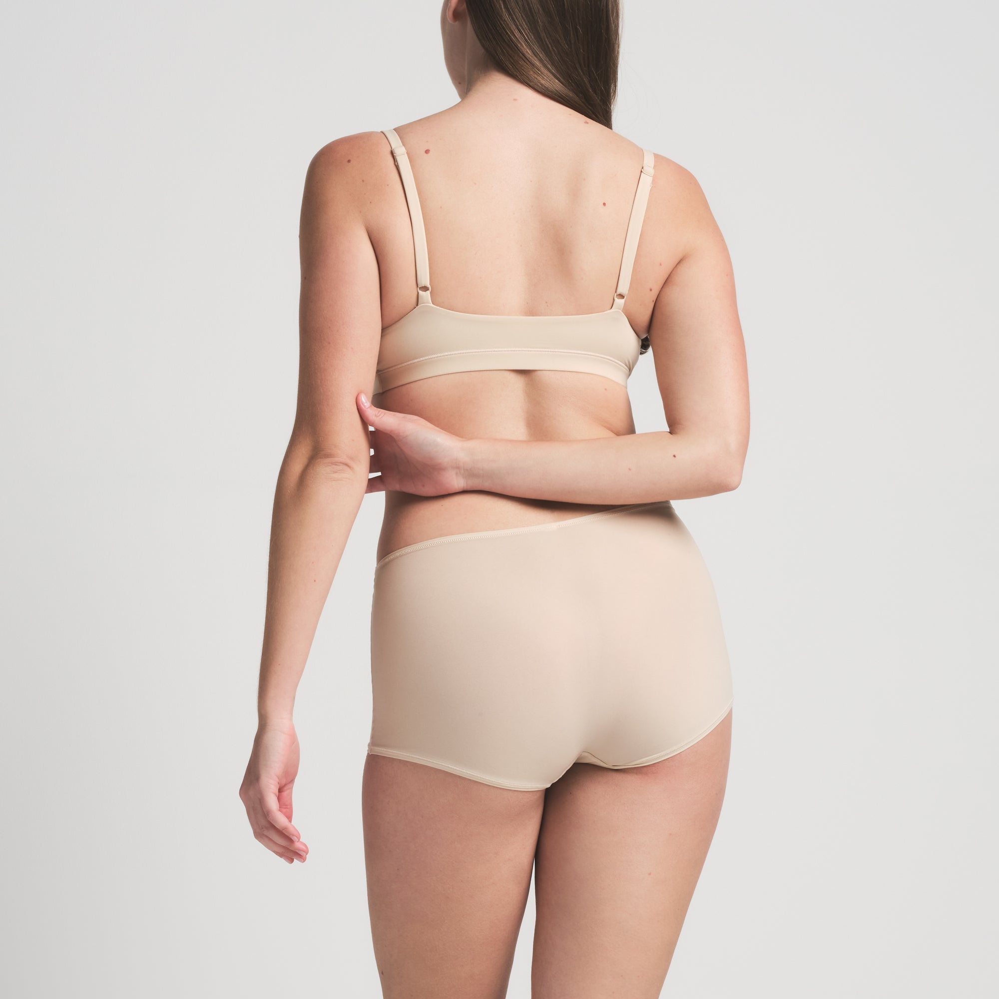 FITS EVERYBODY BOY SHORT | SAND ON A MODEL BACK VIEW | FOCUS: 0.0, 1.0, 0.9