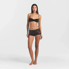 STRETCH LACE RUFFLE UNLINED BRA | SOOT ON A MODEL SIDE VIEW @ | FOCUS: 0.0, 1.0, 0.9