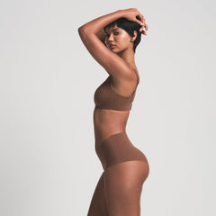 NAKED BOY SHORT WORN BY A MODEL IN SIDE VIEW