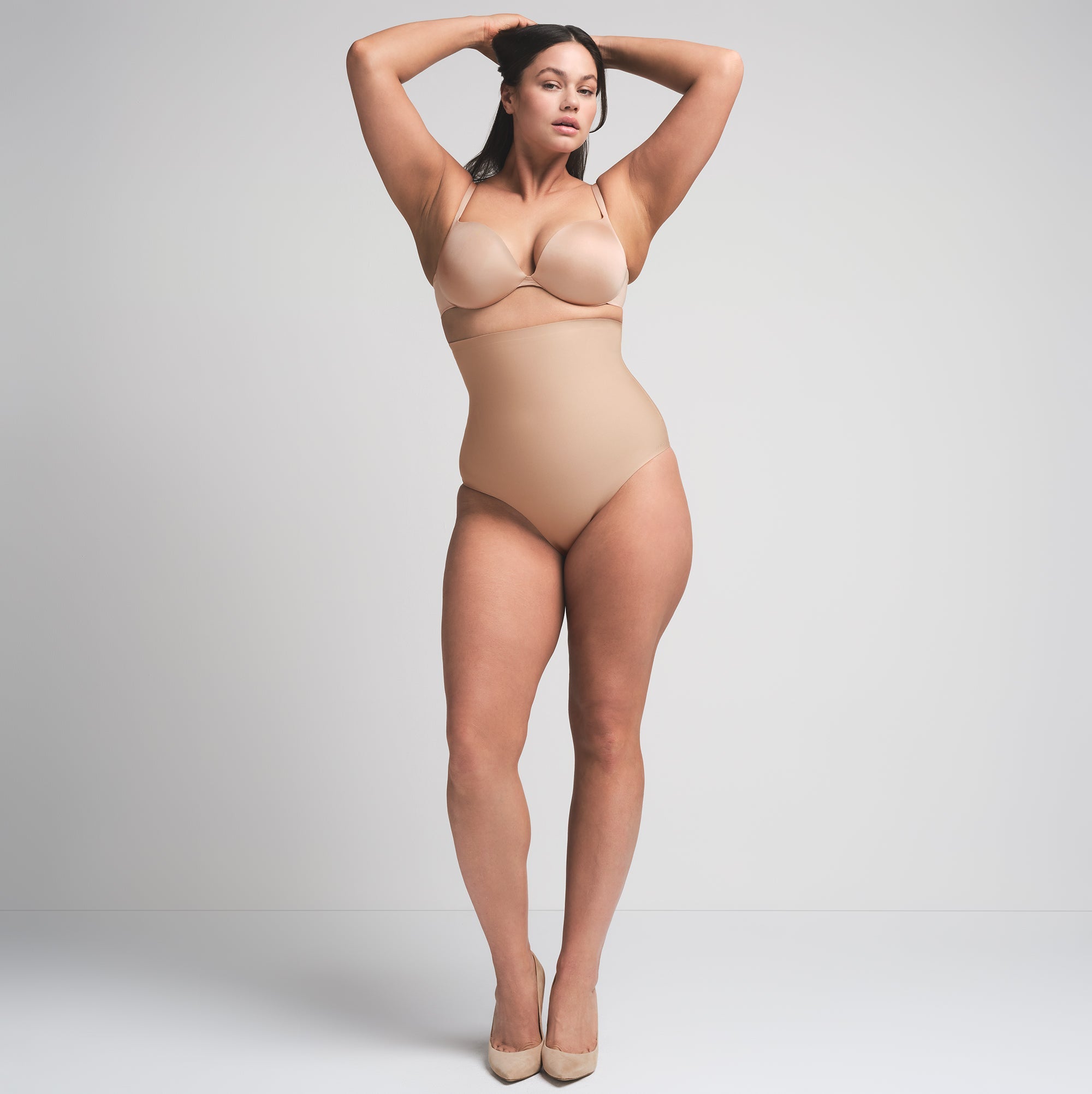 SKIMS BODY CORE SCULPT HIGH-WAISTED BRIEF | CLAY  ON A MODEL FRONT VIEW