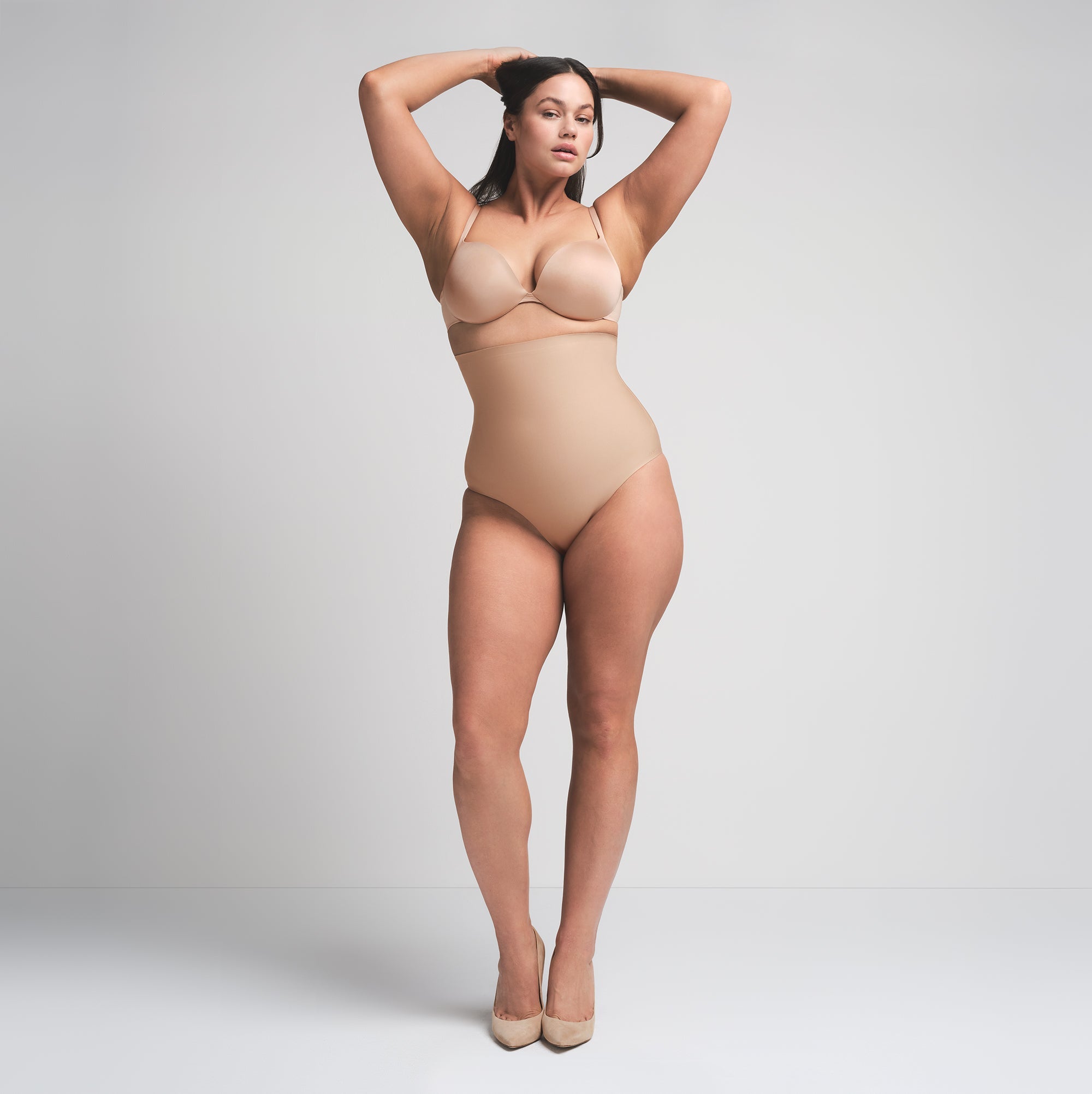 SKIMS BODY CORE SCULPT HIGH-WAISTED BRIEF | CLAY  ON A MODEL FRONT VIEW