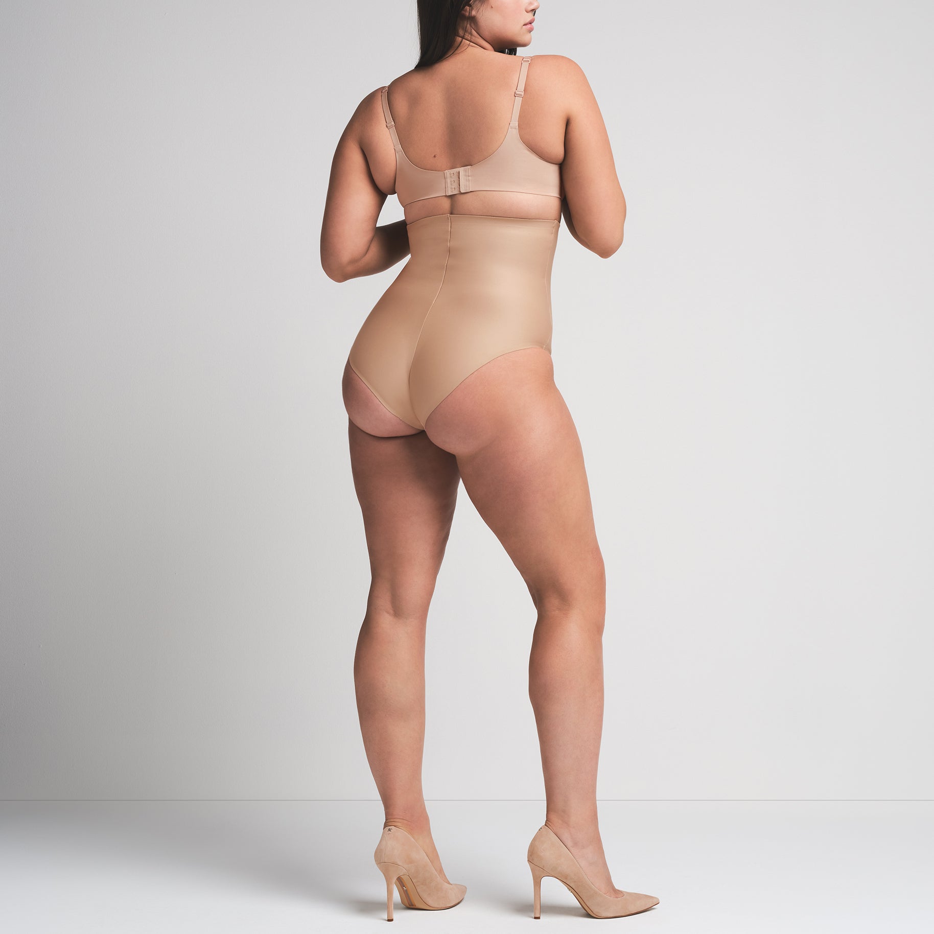 SKIMS BODY CORE SCULPT HIGH-WAISTED BRIEF | CLAY  ON A MODEL BACK VIEW