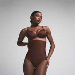 SKIMS BODY CORE SCULPT HIGH-WAISTED BRIEF | COCOA  ON A MODEL FRONT VIEW
