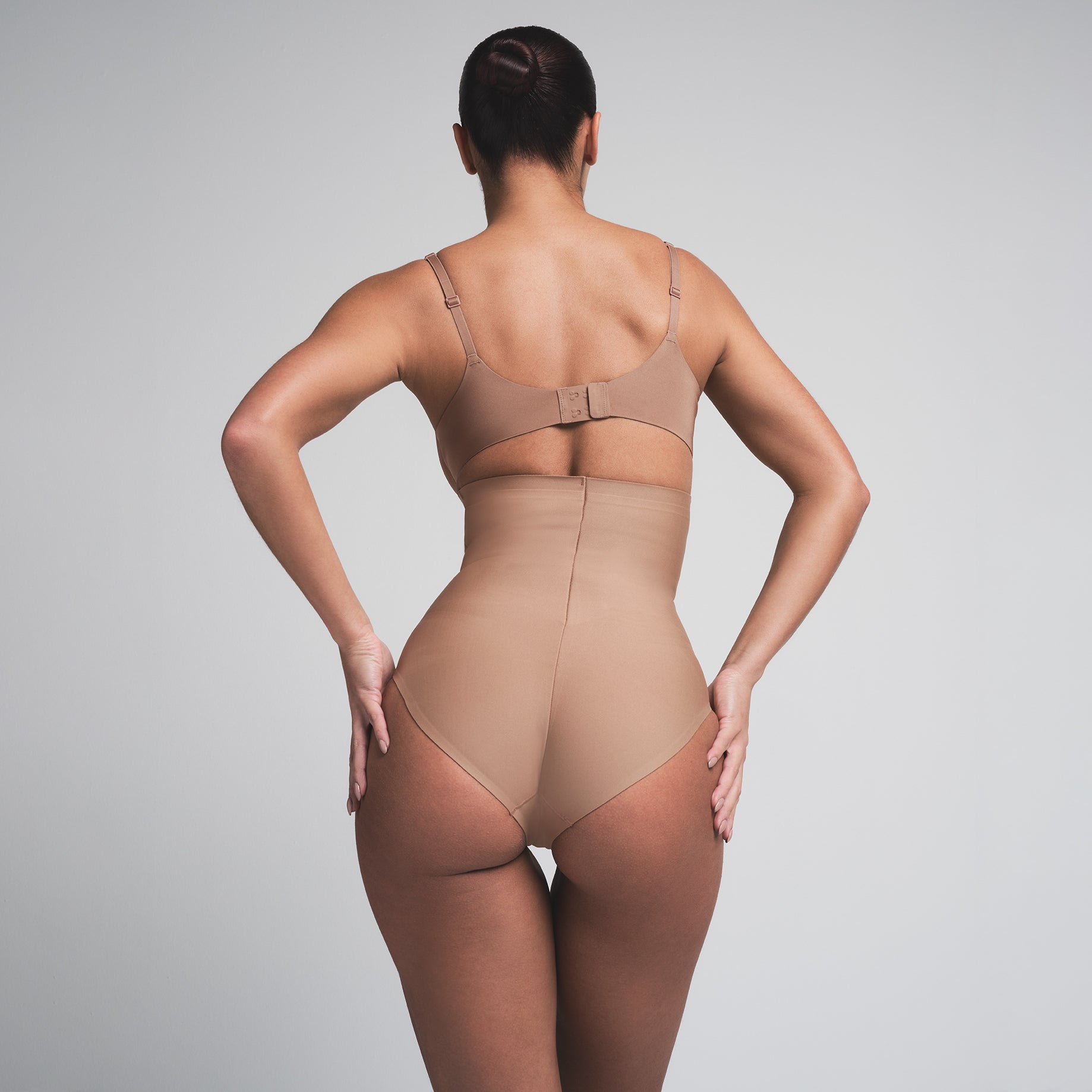 SKIMS BODY CORE SCULPT HIGH-WAISTED BRIEF | SIENNA  ON A MODEL BACK VIEW