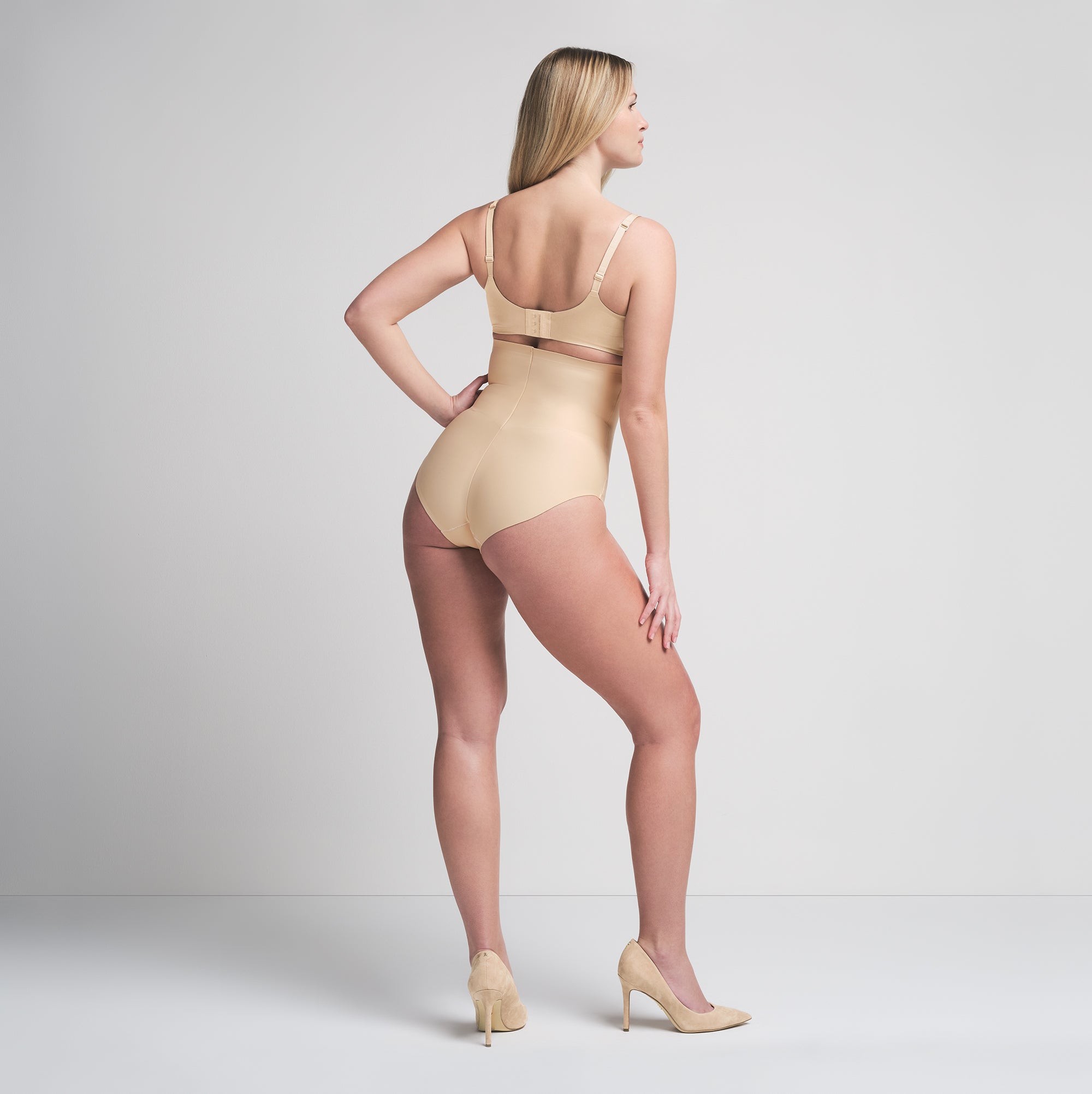 SKIMS BODY CORE SCULPT HIGH-WAISTED BRIEF | SAND  ON A MODEL BACK VIEW