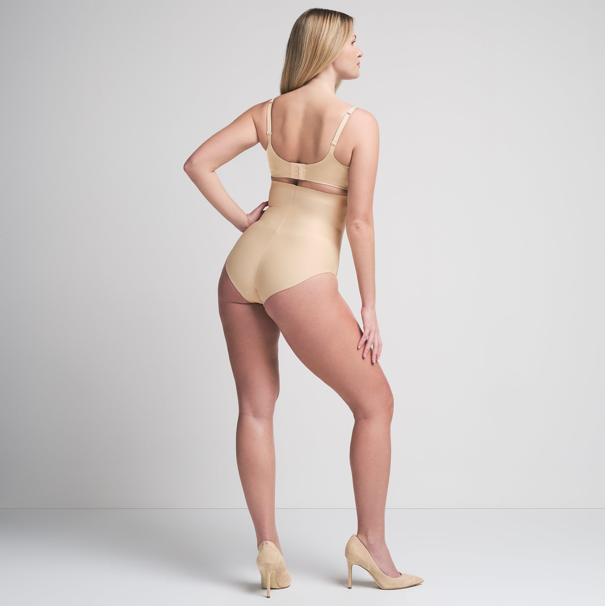 SKIMS BODY CORE SCULPT HIGH-WAISTED BRIEF | SAND  ON A MODEL BACK VIEW