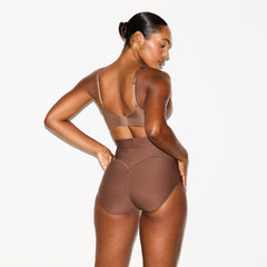 SKIMS BODY CORE SCULPT BUTT LIFTING BRIEF | JASPER ON A MODEL SIDE VIEW @