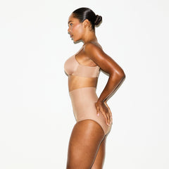SKIMS BODY CORE SCULPT BUTT LIFTING BRIEF | SIENNA ON A MODEL SIDE VIEW @