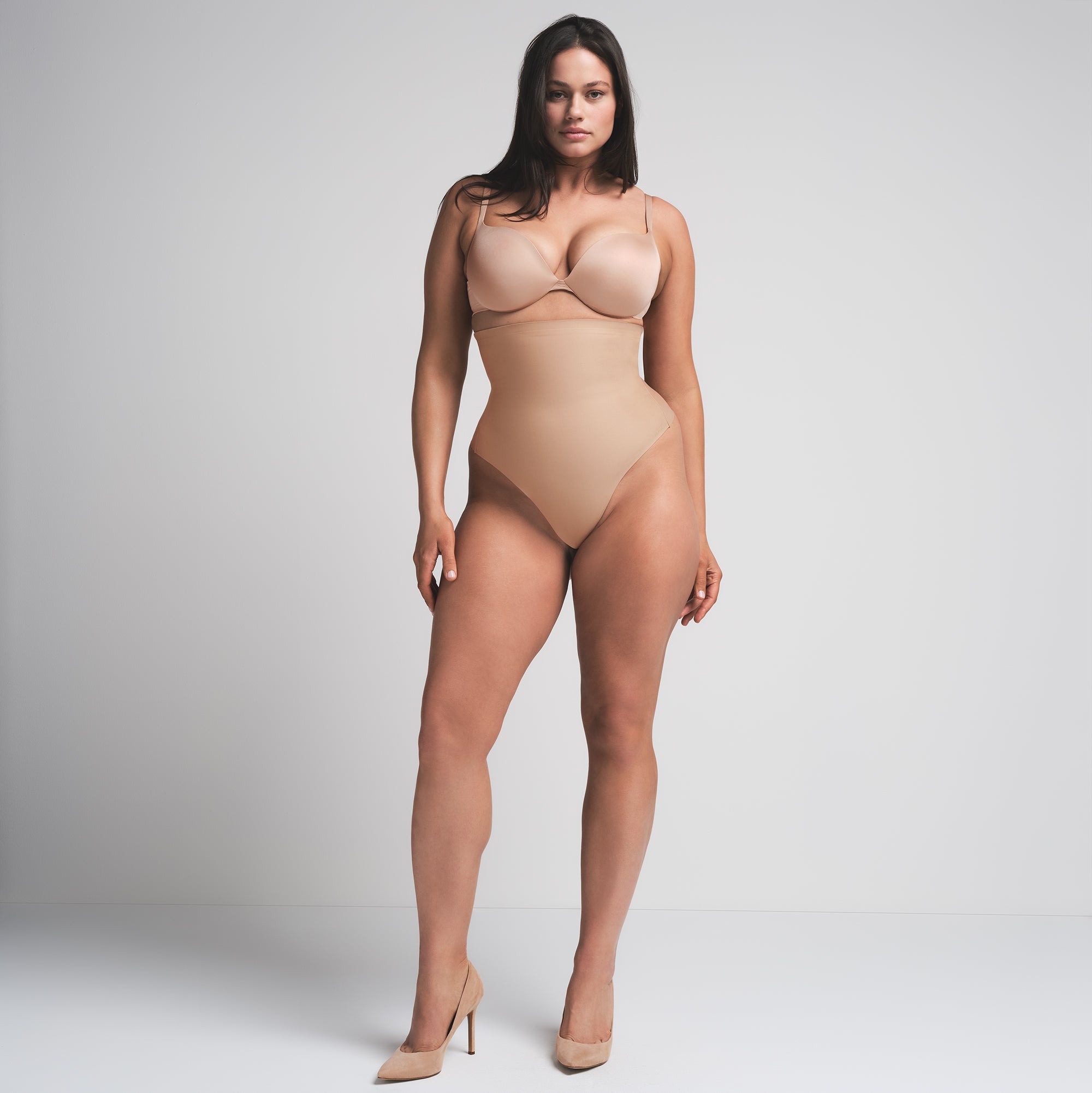 SKIMS BODY CORE SCULPT HIGH-WAISTED THONG | CLAY  ON A MODEL FRONT VIEW
