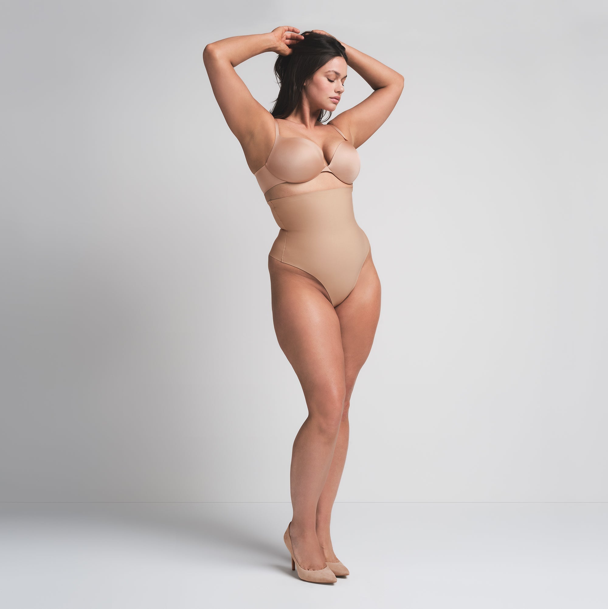 SKIMS BODY CORE SCULPT HIGH-WAISTED THONG | CLAY  ON A MODEL FRONT VIEW