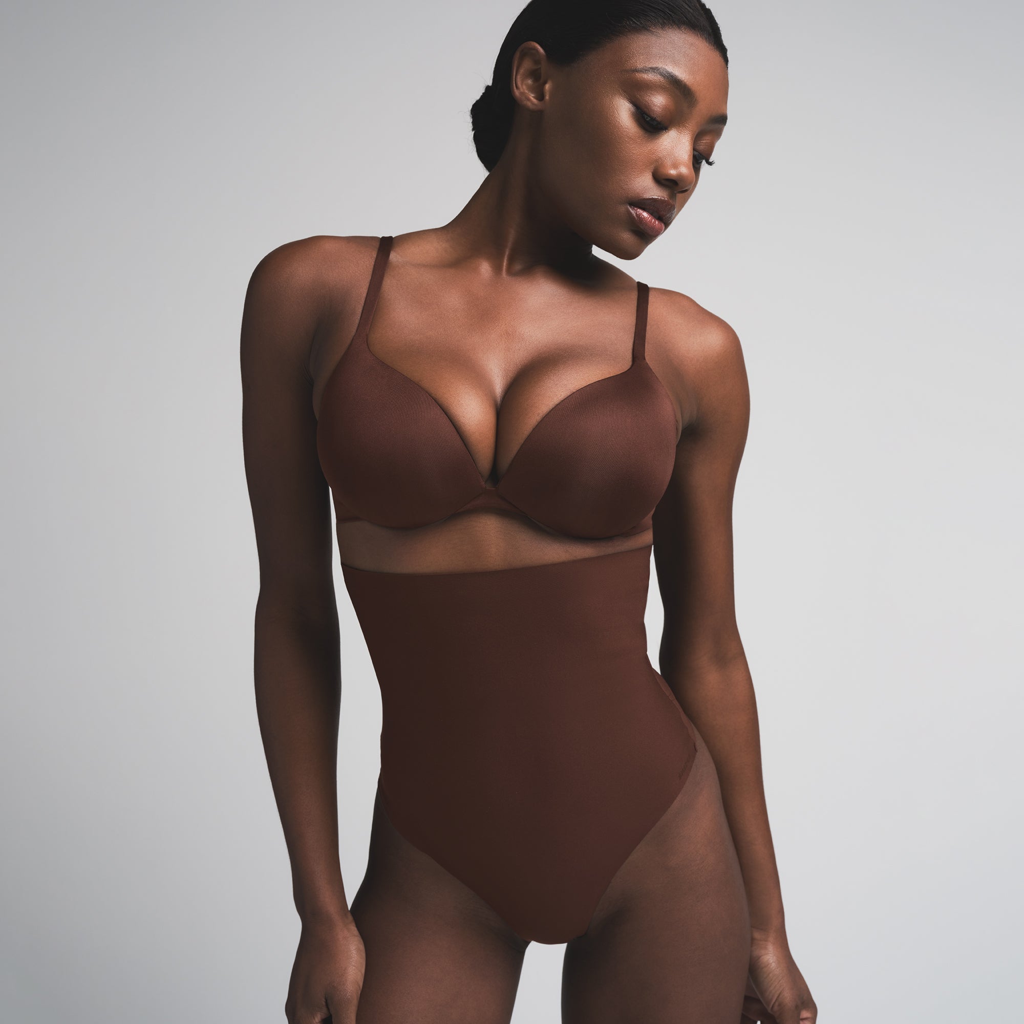 SKIMS BODY CORE SCULPT HIGH-WAISTED THONG | COCOA  ON A MODEL FRONT VIEW