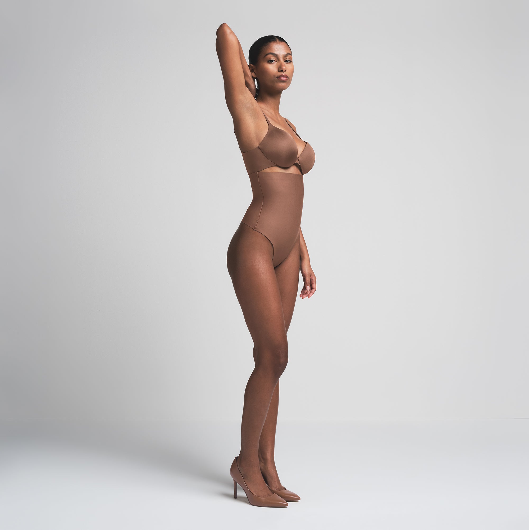 SKIMS BODY CORE SCULPT HIGH-WAISTED THONG | JASPER  ON A MODEL SIDE VIEW