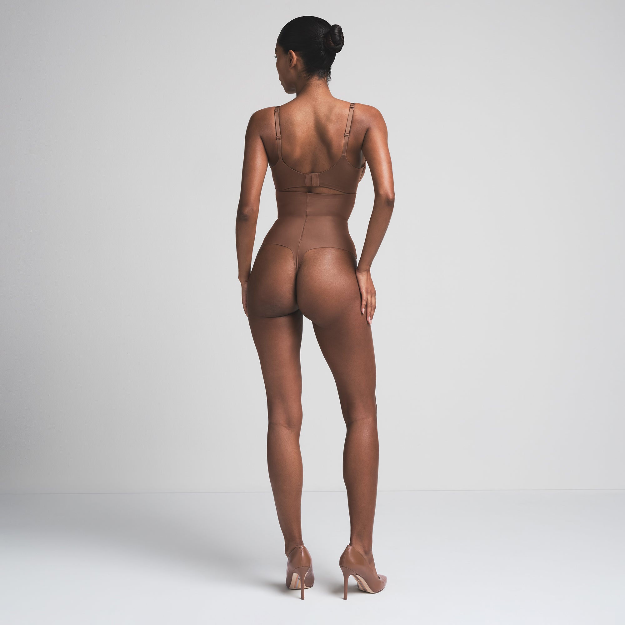 SKIMS BODY CORE SCULPT HIGH-WAISTED THONG | JASPER  ON A MODEL BACK VIEW
