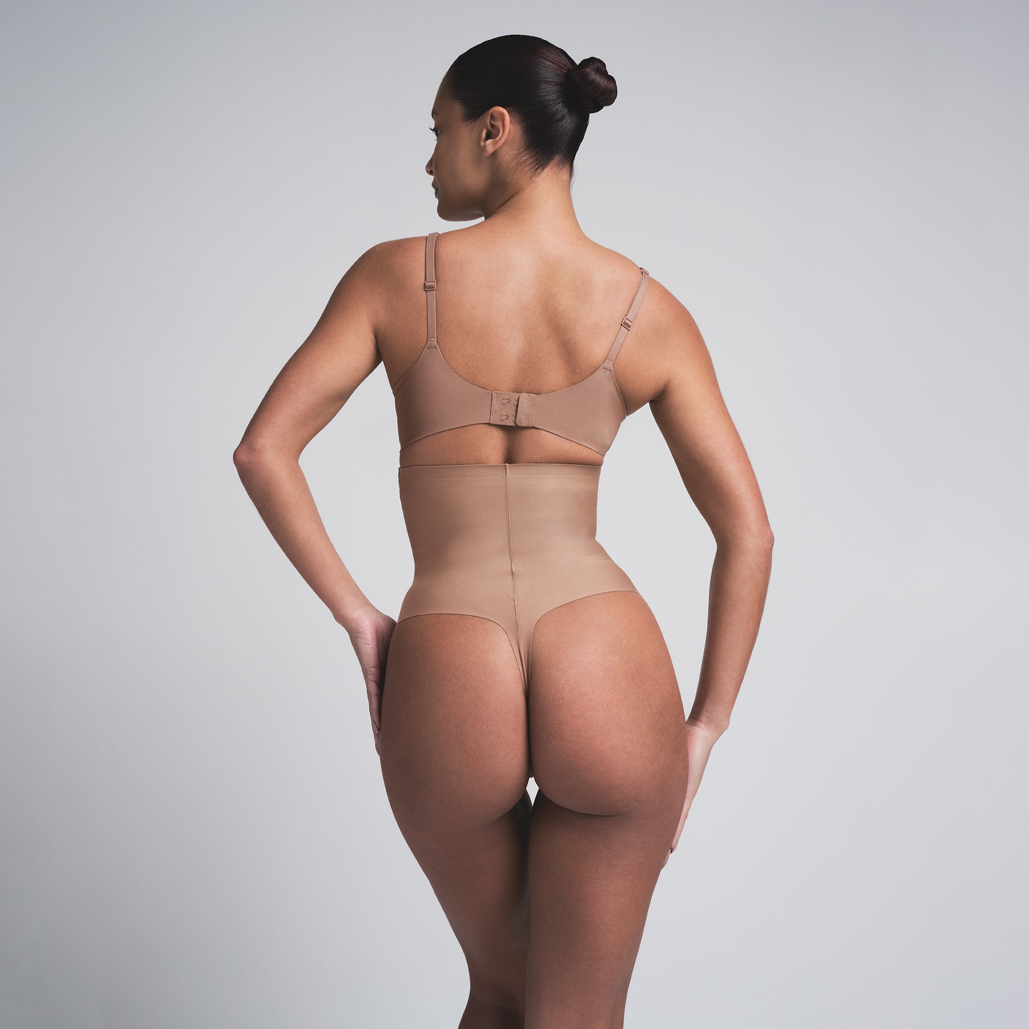 SKIMS BODY CORE SCULPT HIGH-WAISTED THONG | SIENNA  ON A MODEL BACK VIEW