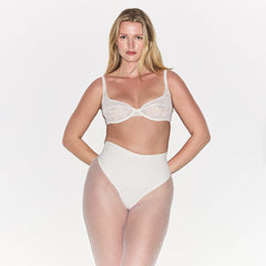 COTTON SHAPEWEAR HIGH-WAISTED THONG | MARBLE ON A MODEL FRONT VIEW | FOCUS: 0.0, 1.0, 0.9