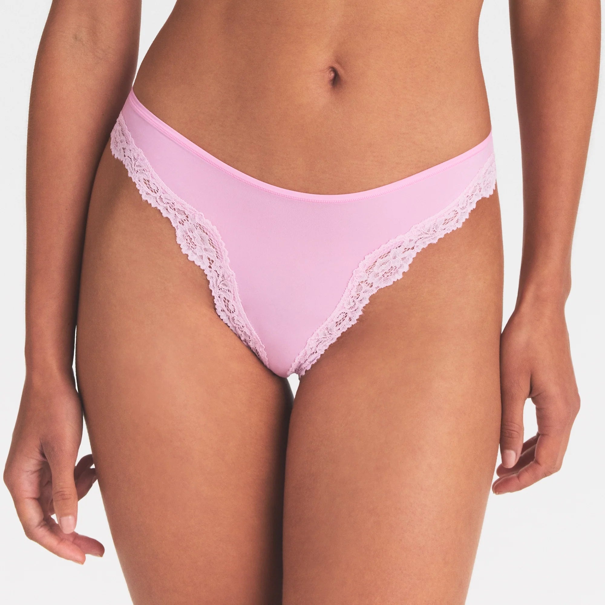 FITS EVERYBODY LACE TANGA | BUBBLE GUM TONAL ON A MODEL SIDE VIEW @ | FOCUS: 0.0, 1.0, 0.9