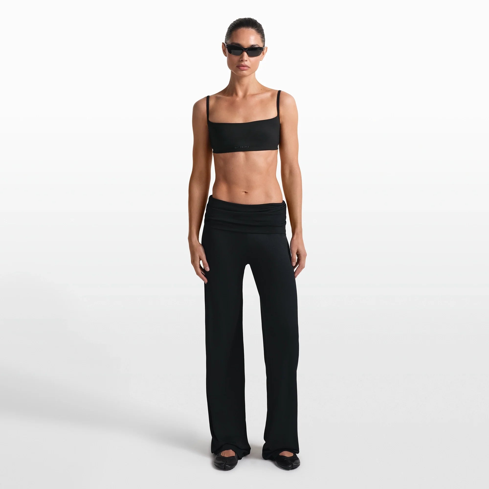 NikeSKIMS STRETCH KNIT FOLDOVER WIDE LEG PANT | OBSIDIAN ON A MODEL FRONT VIEW @ | FOCUS: 0.0, 1.0, 0.9