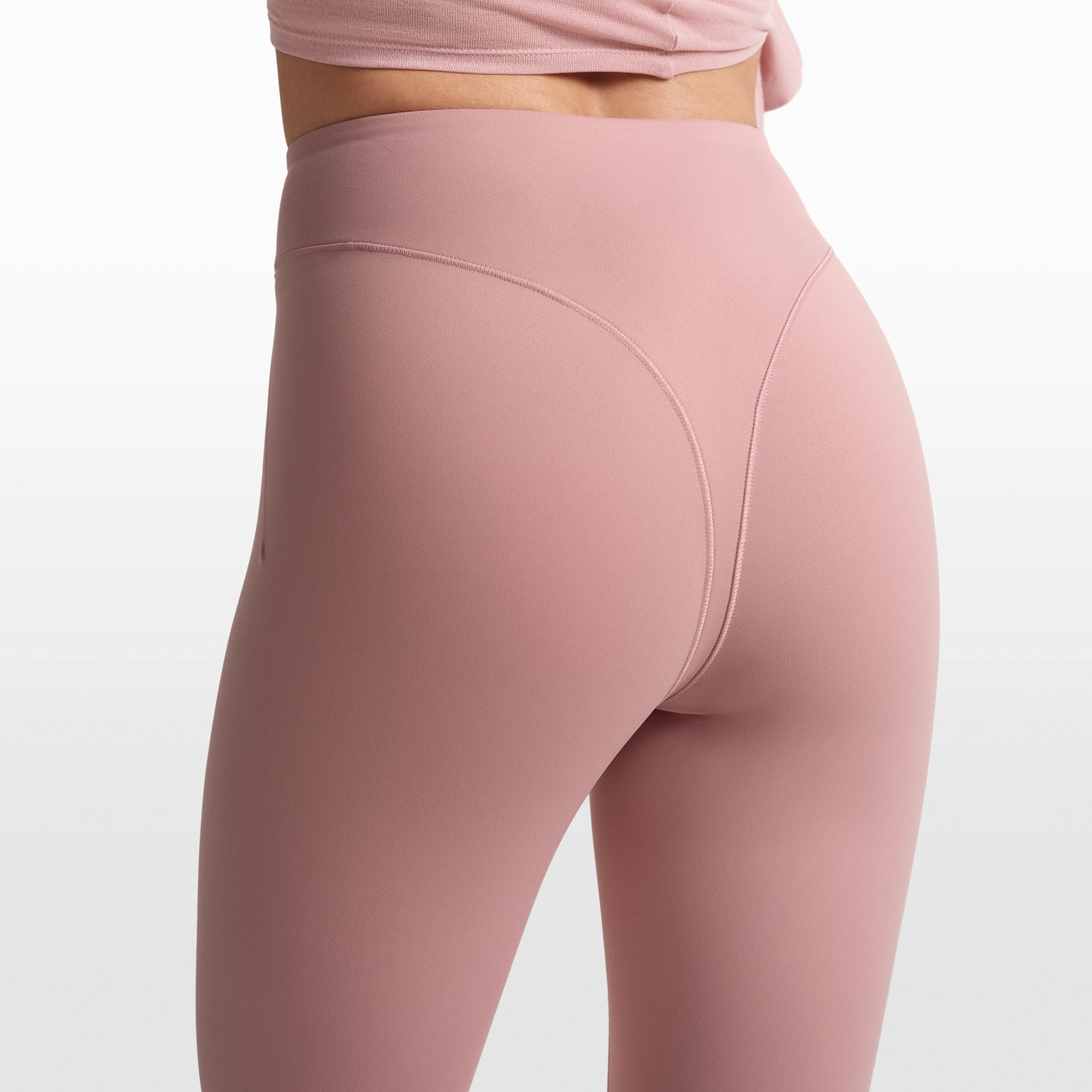 NikeSKIMS MATTE V-LINE STIRRUP LEGGING | HIMALAYAN ON A MODEL FRONT VIEW @ | FOCUS: 0.0, 1.0, 0.9