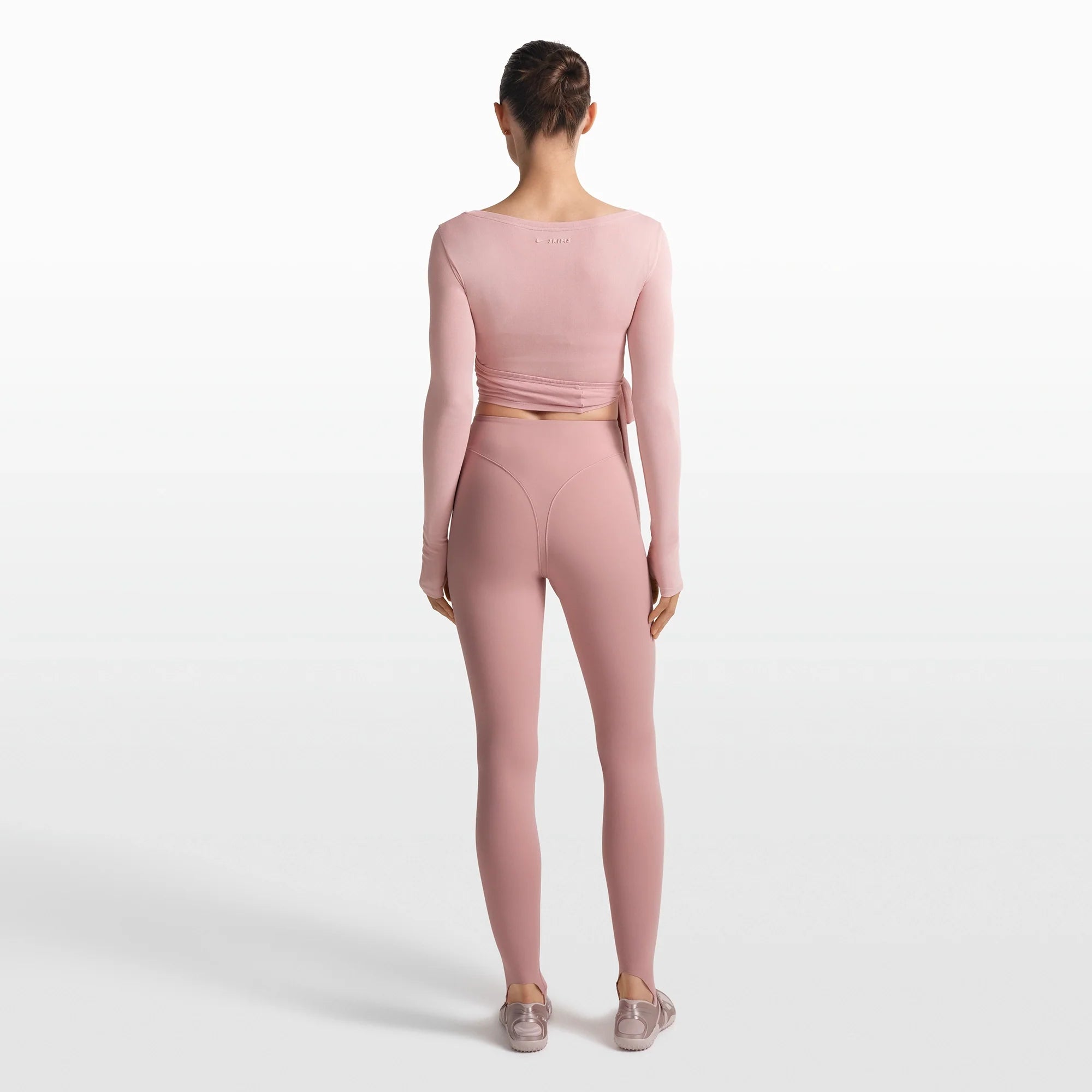 NikeSKIMS MATTE V-LINE STIRRUP LEGGING | HIMALAYAN ON A MODEL FRONT VIEW @ | FOCUS: 0.0, 1.0, 0.9