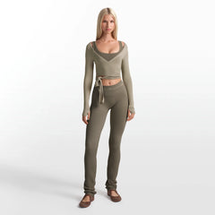 NikeSKIMS RIBBED SEAMLESS 34" STRAIGHT LEGGING | DUSTY OAKMOSS ON A MODEL FRONT VIEW @ | FOCUS: 0.0, 1.0, 0.9