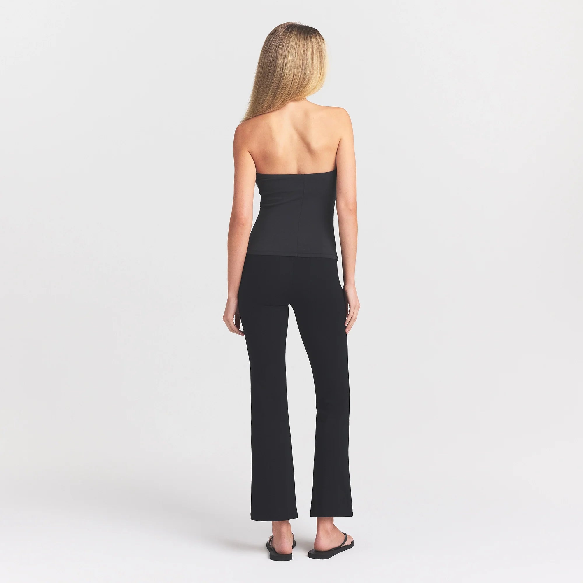 THE ESSENTIAL COLLECTION HIGH-WAISTED CROPPED KICK FLARE PANT | OBSIDIAN ON A MODEL BACK VIEW @ | FOCUS: 0.0, 1.0, 0.9