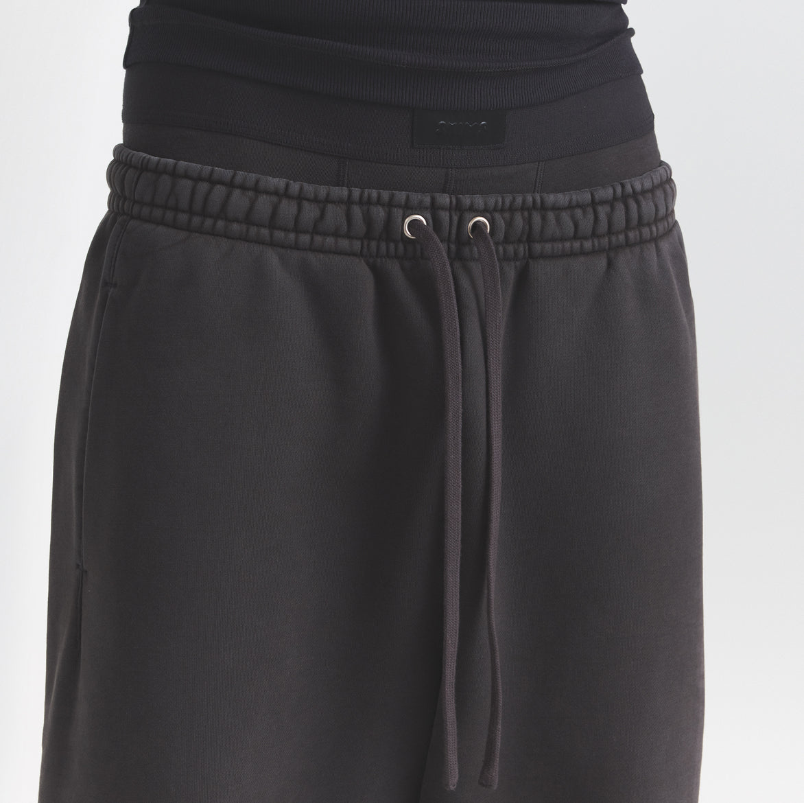 HEAVYWEIGHT FLEECE MENS JOGGER | WASHED ONYX ON A MODEL SIDE VIEW @ | FOCUS: 0.0, 1.0, 0.9