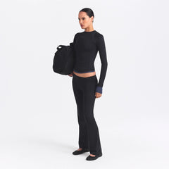 NikeSKIMS AIRY STRAIGHT LEG PANT | OBSIDIAN ON A MODEL SIDE VIEW @ | FOCUS: 0.0, 1.0, 0.9
