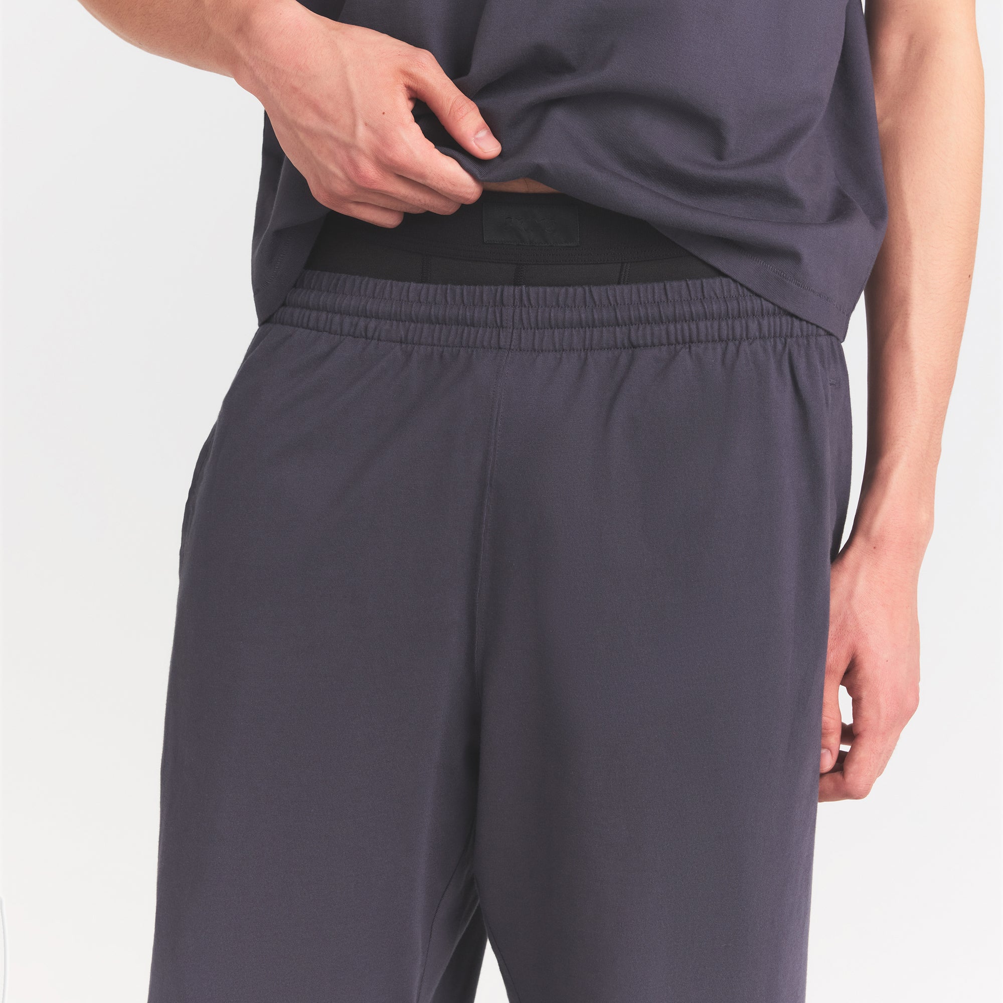 HEAVYWEIGHT COTTON MENS RELAXED PANT | RAVEN ON A MODEL SIDE VIEW @ | FOCUS: 0.0, 1.0, 0.9