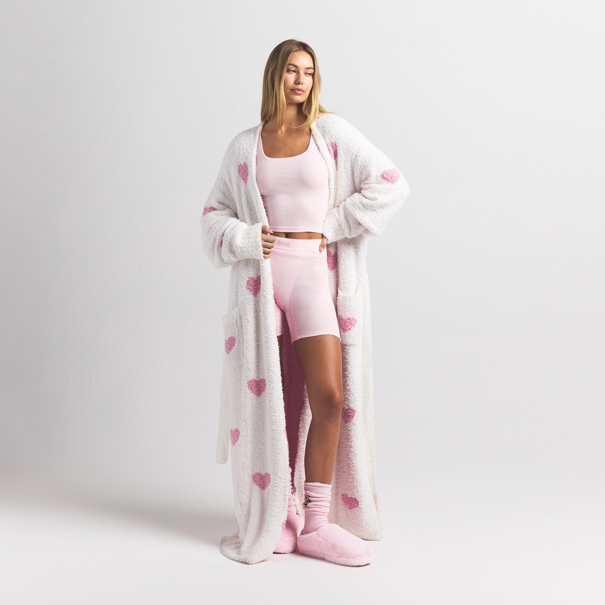 COZY KNIT UNISEX ROBE | IVORY SPACED HEARTS ON A MODEL FRONT VIEW @ | FOCUS: 0.0, 1.0, 0.9