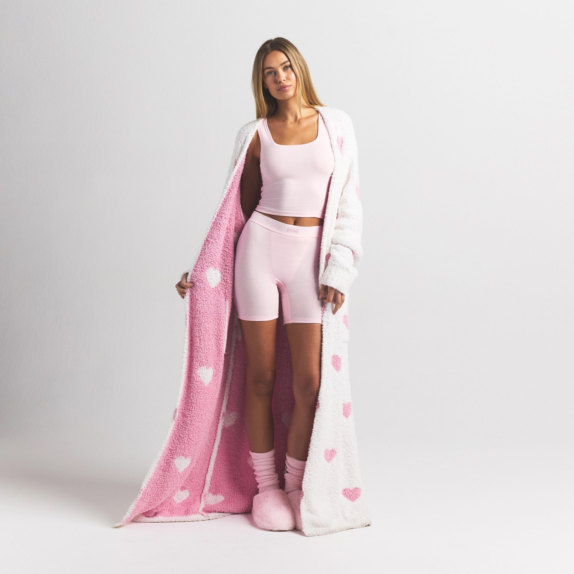 COZY KNIT UNISEX ROBE | IVORY SPACED HEARTS ON A MODEL FRONT VIEW @ | FOCUS: 0.0, 1.0, 0.9